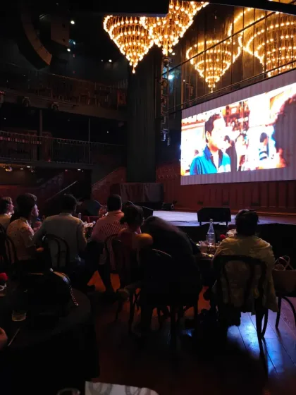 The magic of a shared cinematic moment under the glow of magnificent chandeliers. This shot from our ZNMD screening captures the grand yet intimate feeling of our events.