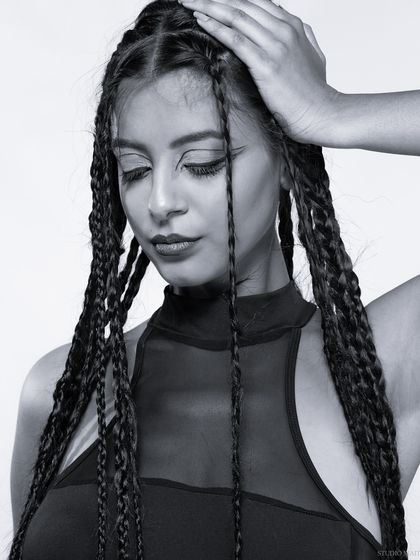 A soft and serene black and white portrait from the braids series.