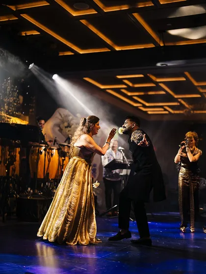 A playful and romantic moment during the couple's dance. The live performance by Neeti Mohan added a touch of star power to this unforgettable Sangeet.