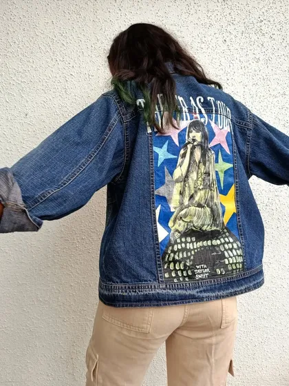 A slightly different angle of the Eras Tour jacket, showcasing the hand-painted design and the overall fit of the garment.