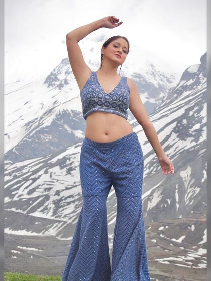 A dynamic pose showing the full outfit and its flattering silhouette.