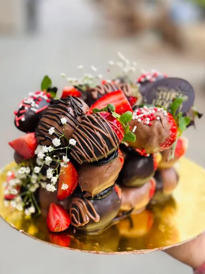 The Dipped Chocolate Strawberry Cube is a showstopper. It's perfect as a unique cake alternative or as the centerpiece of a dessert table.