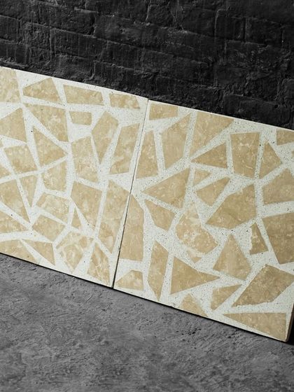 Two of our mosaic-style Venetian terrazzo tiles side-by-side, showing how the pattern continues across tiles for a seamless installation.