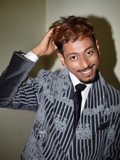 Sarang exudes elegance in our grey velvet coat, meticulously adorned with hand embroidery. The illustrations turn the tuxedo into a wearable narrative, a journey through time and symbolism.