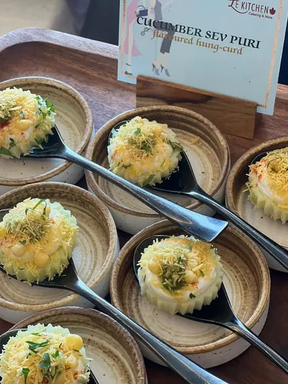 A refreshing and modern twist on a street food classic: our Cucumber Sev Puri, featuring a base of cool cucumber topped with spiced hung curd and crispy sev.