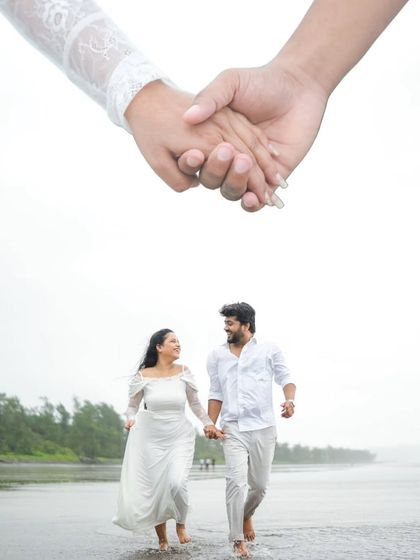 Another creative composition that tells a story of togetherness. The close-up of the hands holding is layered over a shot of the couple running joyfully on the beach, symbolizing their shared journey.