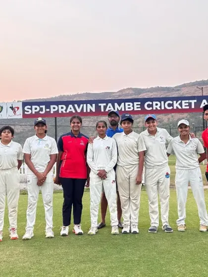 Our girls' team poses with coaches on match day at the SPJ-Pravin Tambe Cricket Academy grounds.