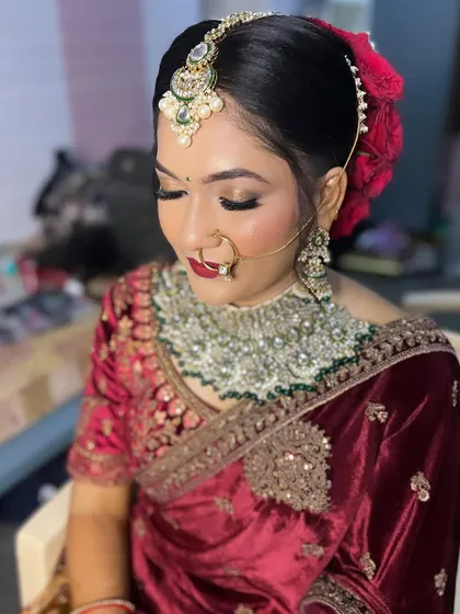 A close-up of the reception makeup, highlighting the sharp winged eyeliner and the flawless base.