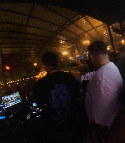 A behind-the-scenes view from the DJ booth with my team.