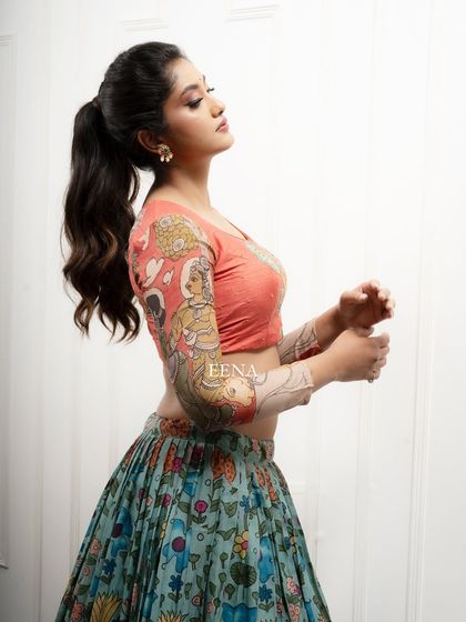 Discover the beauty of traditional craftsmanship with this stunning Pen Kalamkari lehenga. The piece is meticulously hand-painted by my artisans, with a story unfolding on the blouse sleeves and a beautiful floral pattern on the skirt and dupatta.