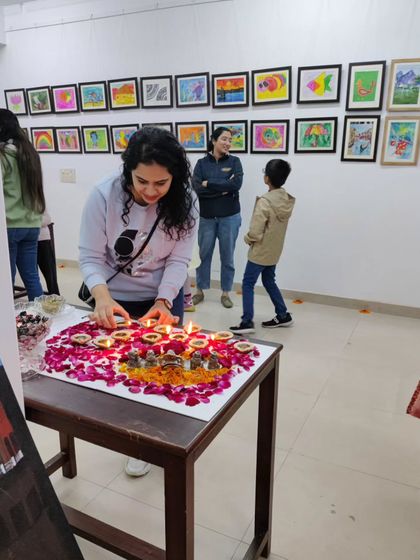 A special moment from our new studio's opening ceremony, with students and parents participating in the traditional lighting of diyas.