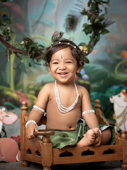 Another shot of our little Krishna in the magical forest, his smile lighting up the scene.