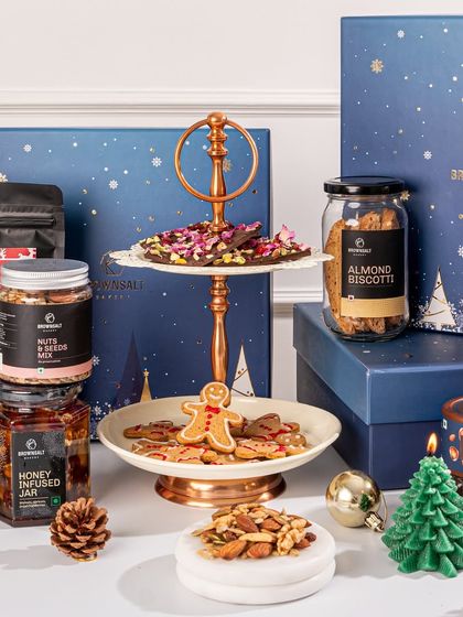 This stunning flat lay shows the abundance of our Christmas collection. It's a celebration of all our festive favorites, from gingerbread cookies to chocolate barks, perfect for corporate holiday gifting.