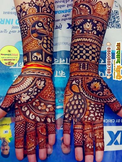 Another example of our detailed festival work, combining traditional peacock and elephant figures. We ensure our designs are symmetrical and beautifully executed on both hands.