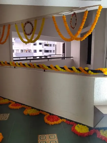 A simple and traditional marigold decoration for a home's balcony or corridor space. Using garlands of fresh zendu flowers is an affordable and beautiful way to prepare the house for an auspicious occasion.