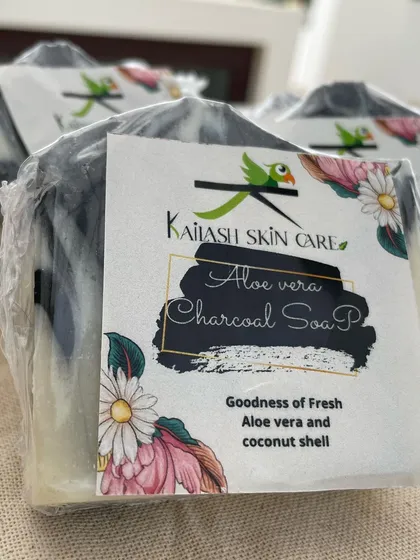 A close-up of the label on my Aloe Vera Charcoal soap, highlighting the goodness of fresh aloe vera and coconut shell. This is a cold process soap, cured for weeks to be extra gentle.