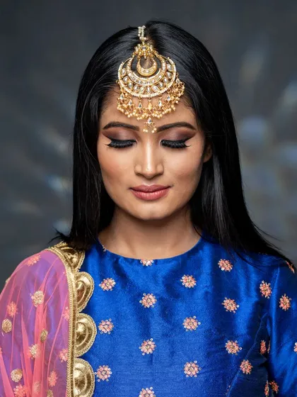 A beautiful close-up of the actor's makeup. The smokey eye is the star of the show, perfectly blended to create a look of intense glamour.