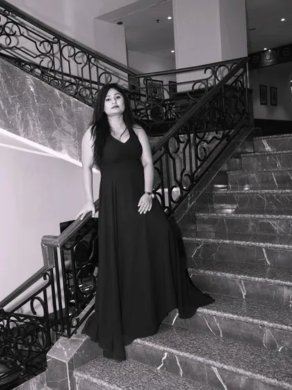 A classic black and white portrait in a timeless black gown. Elegance never goes out of style.