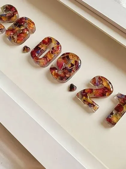 This gallery shows a variety of my personalized photo frames and date keepsakes. From romantic floral designs to minimalist date frames, each piece is handcrafted to preserve your most precious memories.