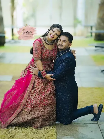 A joyful moment between the bride and groom at their reception. I created a glamorous yet elegant look for the bride's lehenga, focusing on makeup that shines in photos and lasts through a night of celebration.