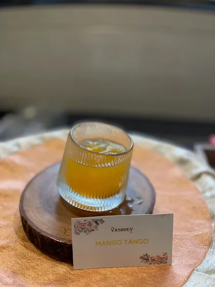 The tropical Mango Tango mocktail, a sweet and tangy drink that brings a taste of summer to your celebration.