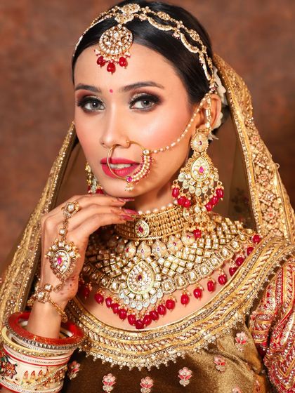 A full bridal portrait featuring our rental attire and jewellery. The combination of the traditional outfit and elaborate accessories creates a complete and breathtaking look.
