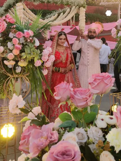 The bride's grand entrance amidst stunning floral arrangements. These are the moments that make for a perfect painting.