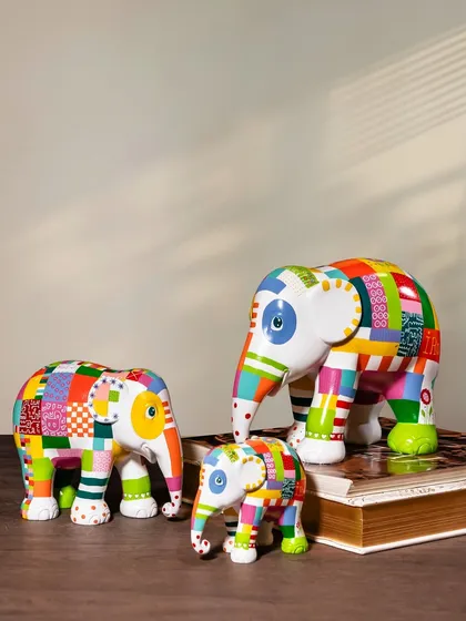 This playful and colorful patchwork design, named "Elmer The Patchwork Elephant," brings a sense of joy and whimsy. These sculptures are perfect for adding a pop of color and a positive story to any room.