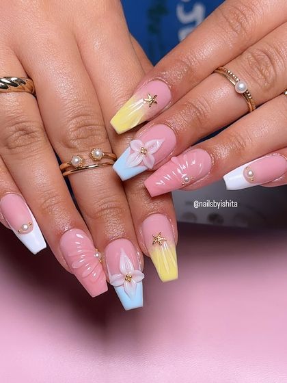 Another shot of these beautiful beach-ready nails, showing the coffin shape and delicate pearl details.