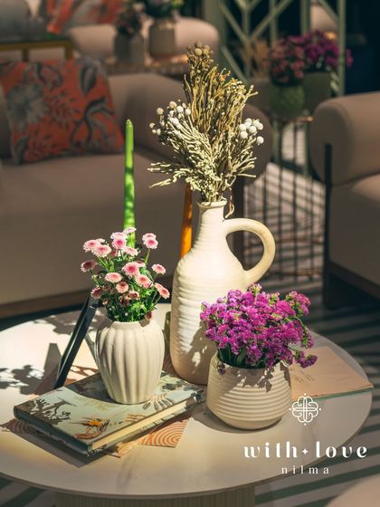 A tabletop detail from 'The Conservatory', with a mix of fresh and dried flowers creating a beautiful textural contrast.