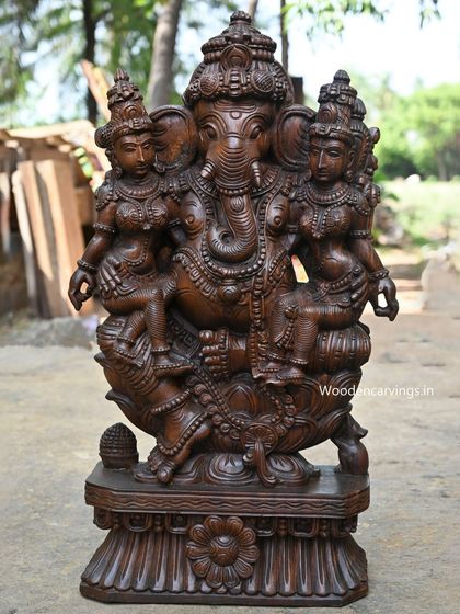 A full view of the Ganesha with Buddhi and Siddhi statue, showing the complete, harmonious composition.