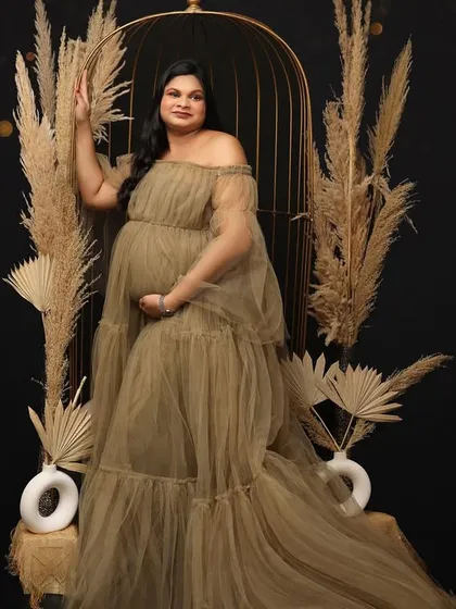 A miracle in the making. This portrait uses a beautiful olive-toned tulle gown and a boho setup with a birdcage to create an earthy yet magical image.