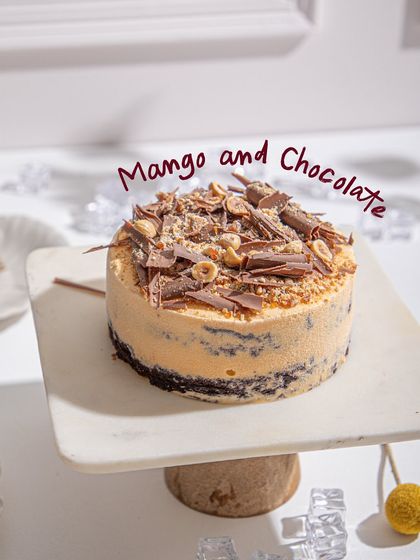 Our Mango and Chocolate ice cream cake, a tropical and indulgent duo perfect for summer celebrations. The sweetness of mango perfectly complements the rich chocolate.
