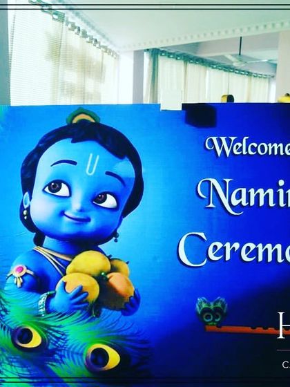 A welcome sign for a naming ceremony featuring an adorable illustration of baby Krishna. This adds a divine and welcoming touch for your guests at the entrance.