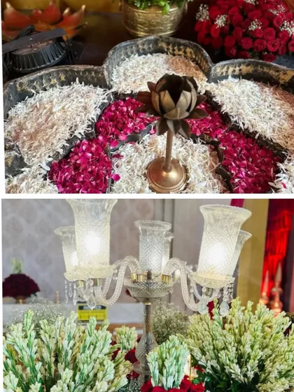 Decor details for a 'Mata ki Chowki' event, featuring intricate floral rangoli and elegant candelabras. We design for all types of traditional and religious functions.