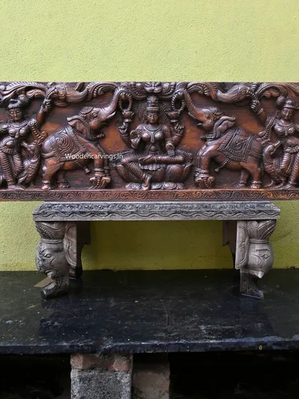 A 48-inch Gaja Lakshmi panel, where the goddess is flanked by elephants with upraised trunks. This powerful symbol of prosperity and royalty is carved with immense detail and strength.