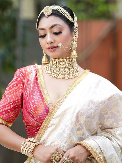 Another beautiful portrait of the model, capturing the grace and elegance of the complete look.