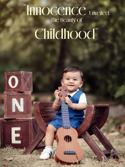 Innocence unveiled. This happy little musician is all smiles with his ukulele during his outdoor first birthday photoshoot.