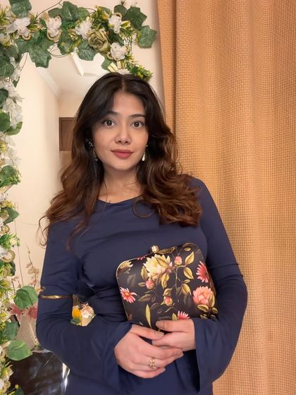 Another angle showing how a statement clutch can be the centerpiece of your look.