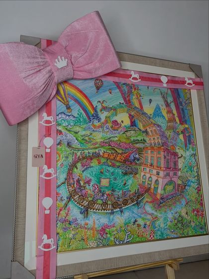 A whimsical framed artwork complements the pink hot air balloon theme, adding a touch of artistry to the nursery decor.
