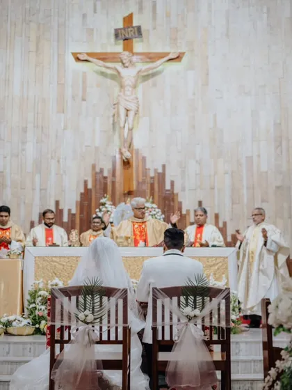 A moment of serene prayer and union during Jeffrey and Delilah's beautiful Christian wedding. The sanctity of the church and the couple's devotion created an atmosphere of profound peace.