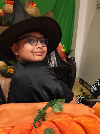 This young wizard is all dressed up and ready for our Halloween celebration. We love seeing the creativity and excitement that our festive events bring out in the children.