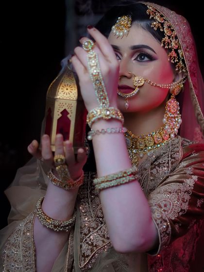 This artistic shot with a lantern adds a moody and atmospheric touch to the Khaliji bridal portfolio.