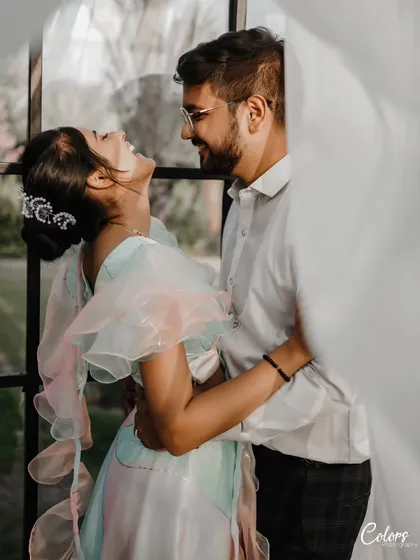 The best moments are often the unscripted ones. This is a candid pre-wedding shot filled with genuine laughter, showing the couple's natural connection.
