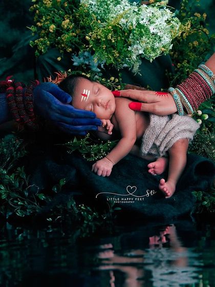 A conceptual and powerful image celebrating Shivratri. The hands of Shiv and Parvati bless the sleeping newborn, creating a portrait filled with divine energy and parental love.