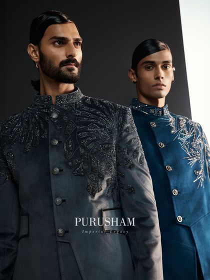 Another look at the brilliance of the embroidery. The way the light catches the details on these grey and blue jackets is a testament to the hours of handwork invested in each piece.