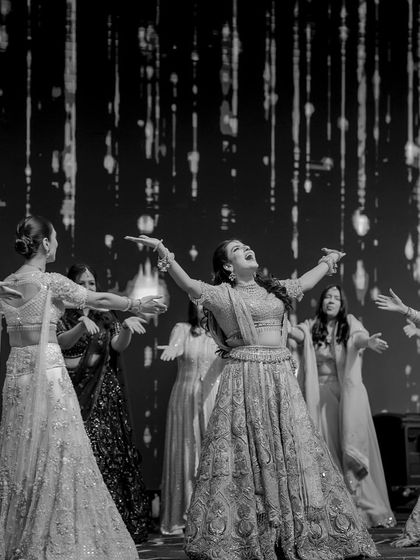 A beautiful black and white shot of the bride and her squad, capturing the joy and freedom in their performance.
