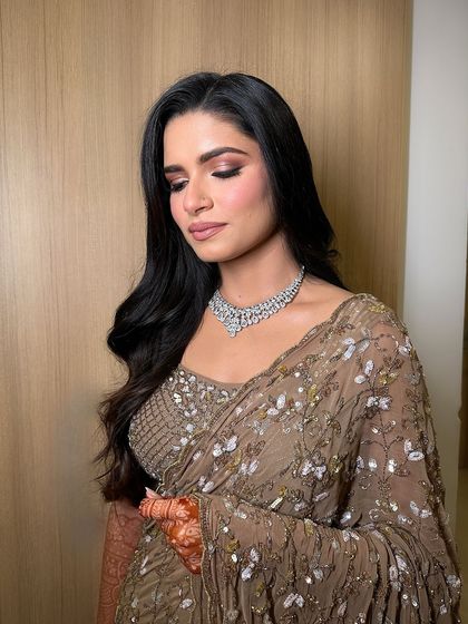 A close-up of the shimmery eyeshadow and perfectly blended skin, creating a look that is both glamorous and sophisticated for a reception.