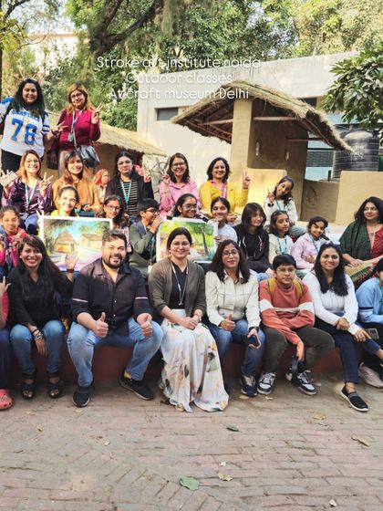 A happy group of students and instructors pose for a photo at the Craft Museum, marking the end of a memorable and creative outdoor art session.