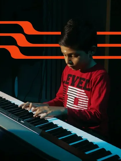 A young student completely focused on his piano piece. Our recitals showcase the progression of our students, from beginners to confident musicians.